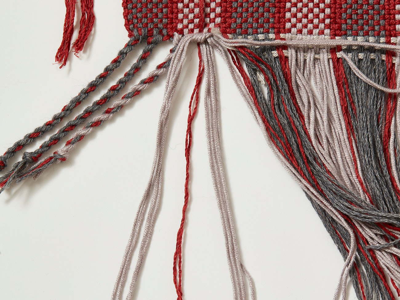 Tie added weft in with a knot at the edge. Photo credit: George Boe