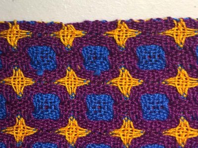 e. The selvedge will show the inactive wefts, depending on the weave structure.